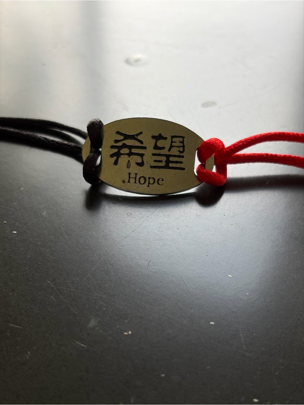 Chinese Hope Engraved Oval Pendant Bracelet - Red & Black Cord